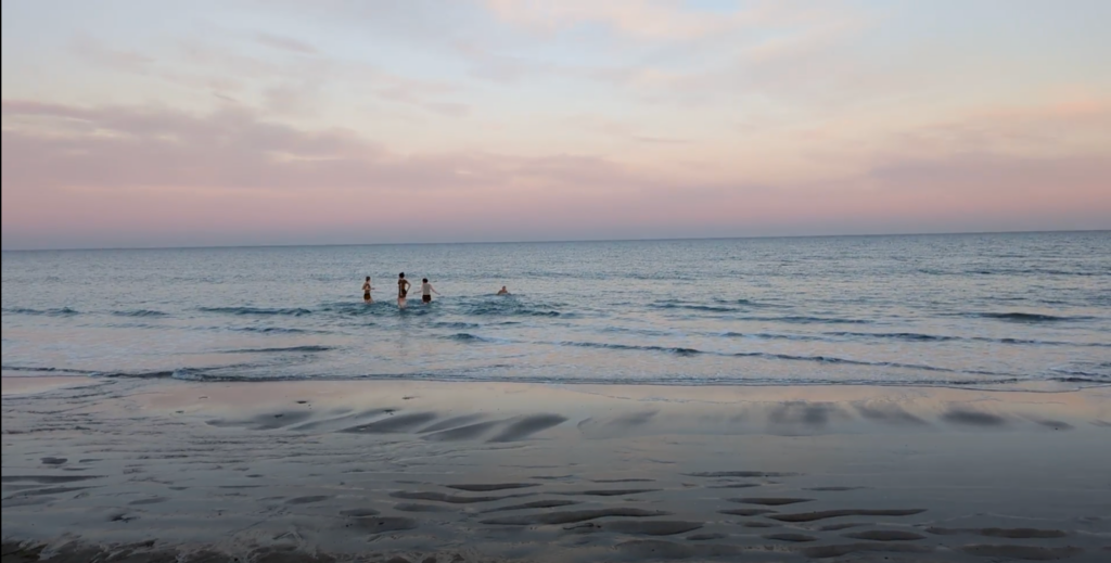 The Rivergate team takes a dip in the freezing cold ocean.